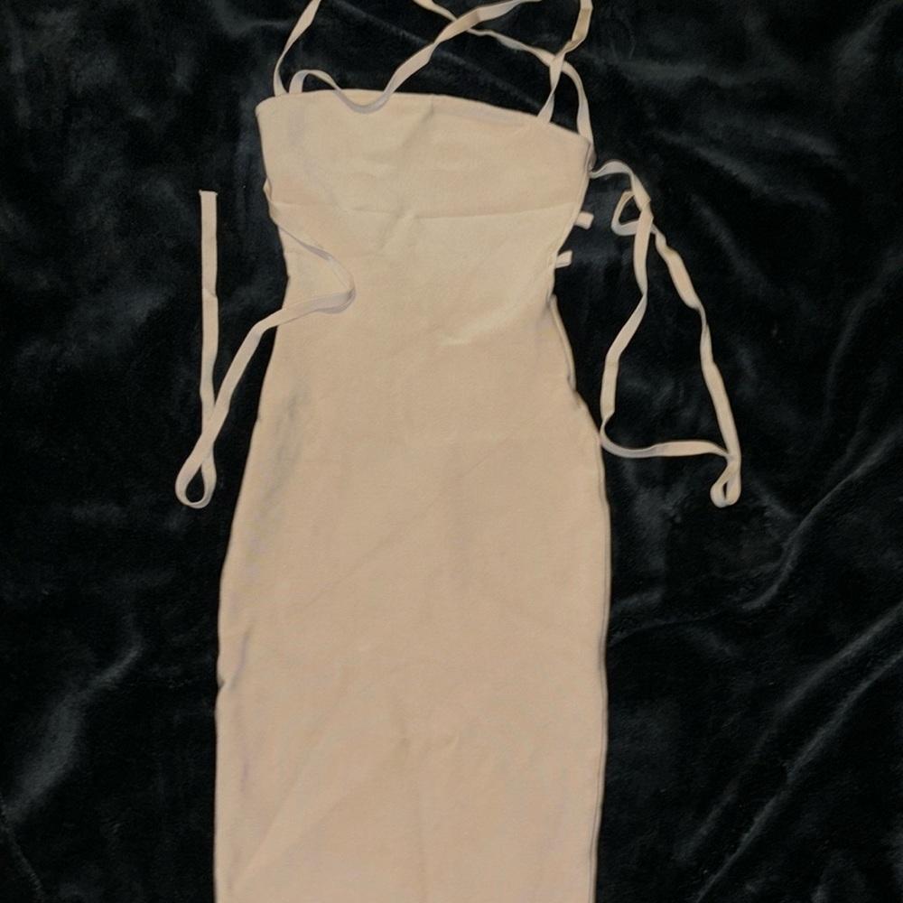 Nude open back super stretchy sleeveless dress. Thick high quality material.